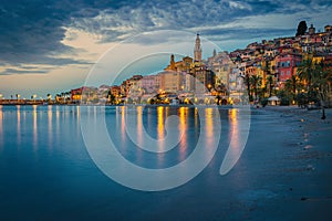 Old colorful mediterranean seaside buildings in Menton at dawn, France