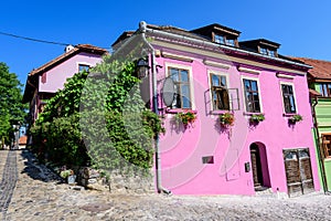 Old colorful painted houses in the historical center of the Sighisoara citadel, in Transylvania Transilvania region of Romania,