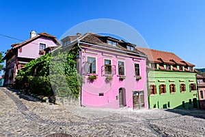 Old colorful painted houses in the historical center of the Sighisoara citadel, in Transylvania Transilvania region of Romania,