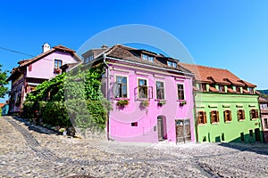 Old colorful painted houses in the historical center of the Sighisoara citadel, in Transylvania Transilvania region of Romania,