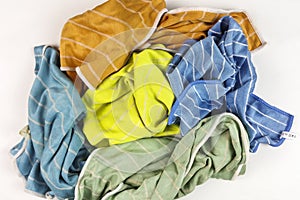 Old colorful rags on white background photo