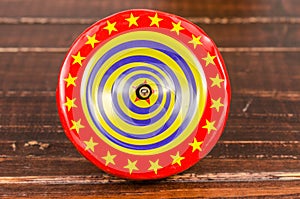 Old colorful wooden spinning top toy