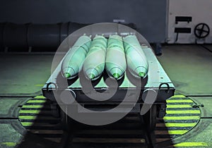 Old combat torpedoes for submarines in an underground storage bunker