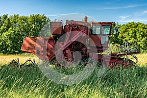 Old Combine Harvester in Field