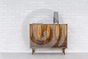 Old commode as a decoration of a modern flat