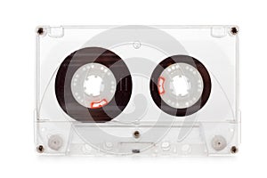 Old compact audio cassette, macro shot on white background, empty