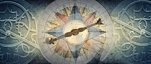 Old compass and Astrolabe - ancient astronomical device on vintage background. Abstract old conceptual background on history, photo