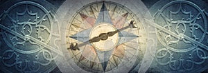 Old compass and Astrolabe - ancient astronomical device on vintage background. Abstract old conceptual background on history,