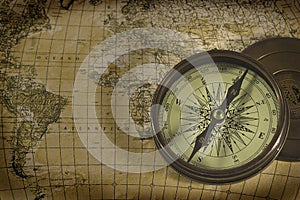 Old compass over map