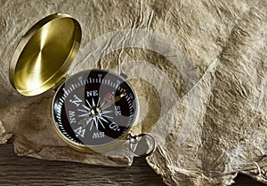 Old compass and paper