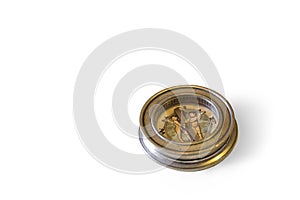 Old compass with shadow on a white background