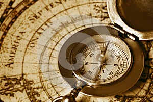 Old compass on vintage map