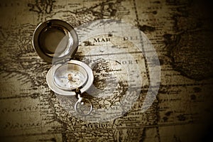 Old compass on vintage map