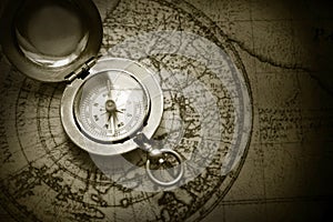 Old compass on vintage map