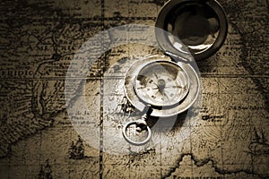 Old compass on vintage map