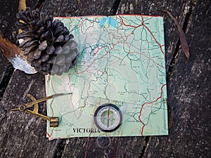 Old compass on vintage map on Australia. Retro navigation device.