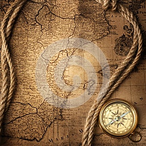 Old compass on vintage map