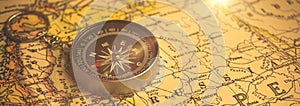 Old compass on a world map, retro banner background for exploration and navigation theme, copy space design