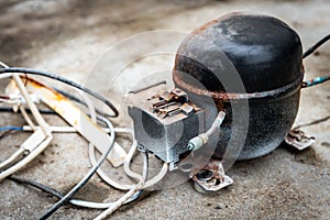 Old compressor from the refrigerator.