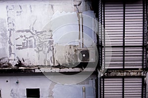 The old compressor on an old wall, vintage style