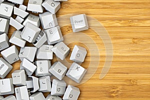 Old computer keyboard keys on the wooden table background
