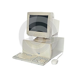 Old computer monitor, keyboard, system unit and mouse on white background