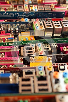 Old computer motherboards. Piles of obsolete hardware and electronic components