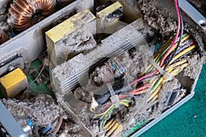 Old computer power supply in a thick layer of dust