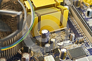 Old computer system unit with spiderweb and dust inside