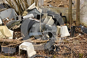 Old computers and monitors abandoned in the suburbs