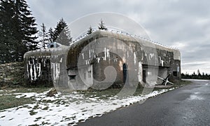 Old concrete infantry blockhouse Na Holem in Bartosovice, Czech Republic, on a gloomy cloudy day of winter. Military