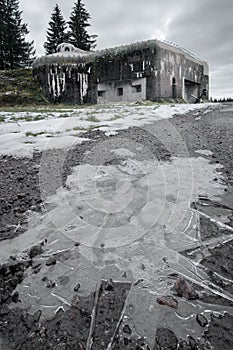 Old concrete infantry blockhouse Na Holem in Bartosovice, Czech Republic, on a gloomy cloudy day of winter. Military