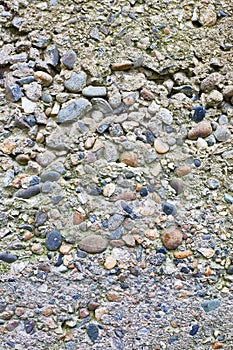 Old concrete from large stones. Stone wall vertical background