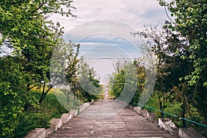 An old concrete staircase leading to the river.