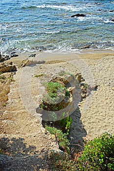 Old concrete stairss on a sandy beach