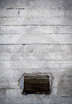 Old concrete wall with vent