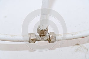 Old connection fitting tee on plastic pipes