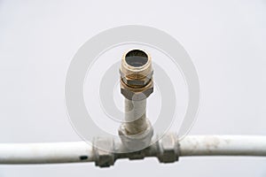 Old connection fitting tee on plastic pipes