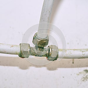 Old connection fitting tee on plastic pipes