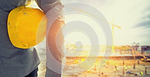 Old construction helmets with Worker in a construction site