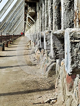 Old construction made of wooden logs, wooden logs covered with salt tarnish