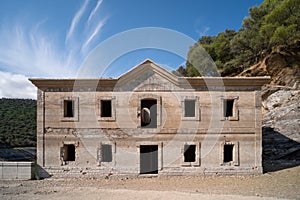 Old construction next to Cardenal bridge over Tagus river photo