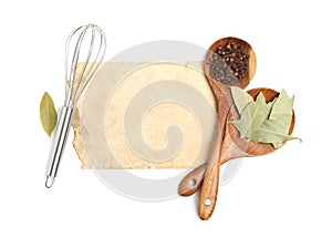 Old cookbook page, spices and kitchen utensils on white background, top view. Space for text