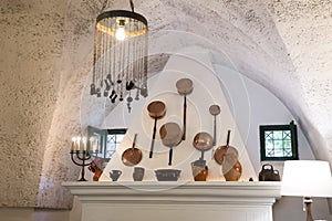 Old copper cooking pot display above a mantle in Masseria Il Frantoio, Southern Italy