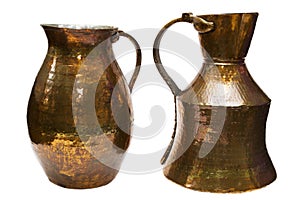 Old copper pitchers