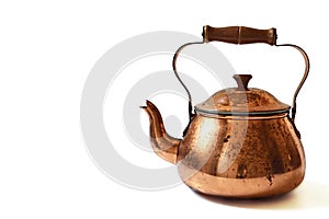 Old copper teapot isolated on white