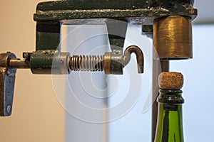Old corking machine with cava bottle