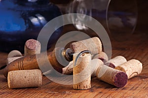 Old corkscrew and corks