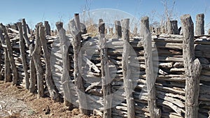 Old corral fence of an enclosure for confining livestock