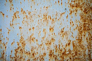 Old corroded metal wall background with flaky blue paint .Rusty flaky cracked metal surface.Abstract the surface texture of the o